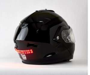 black snowmobile helmet with Biteharder's red helmet safety light installed