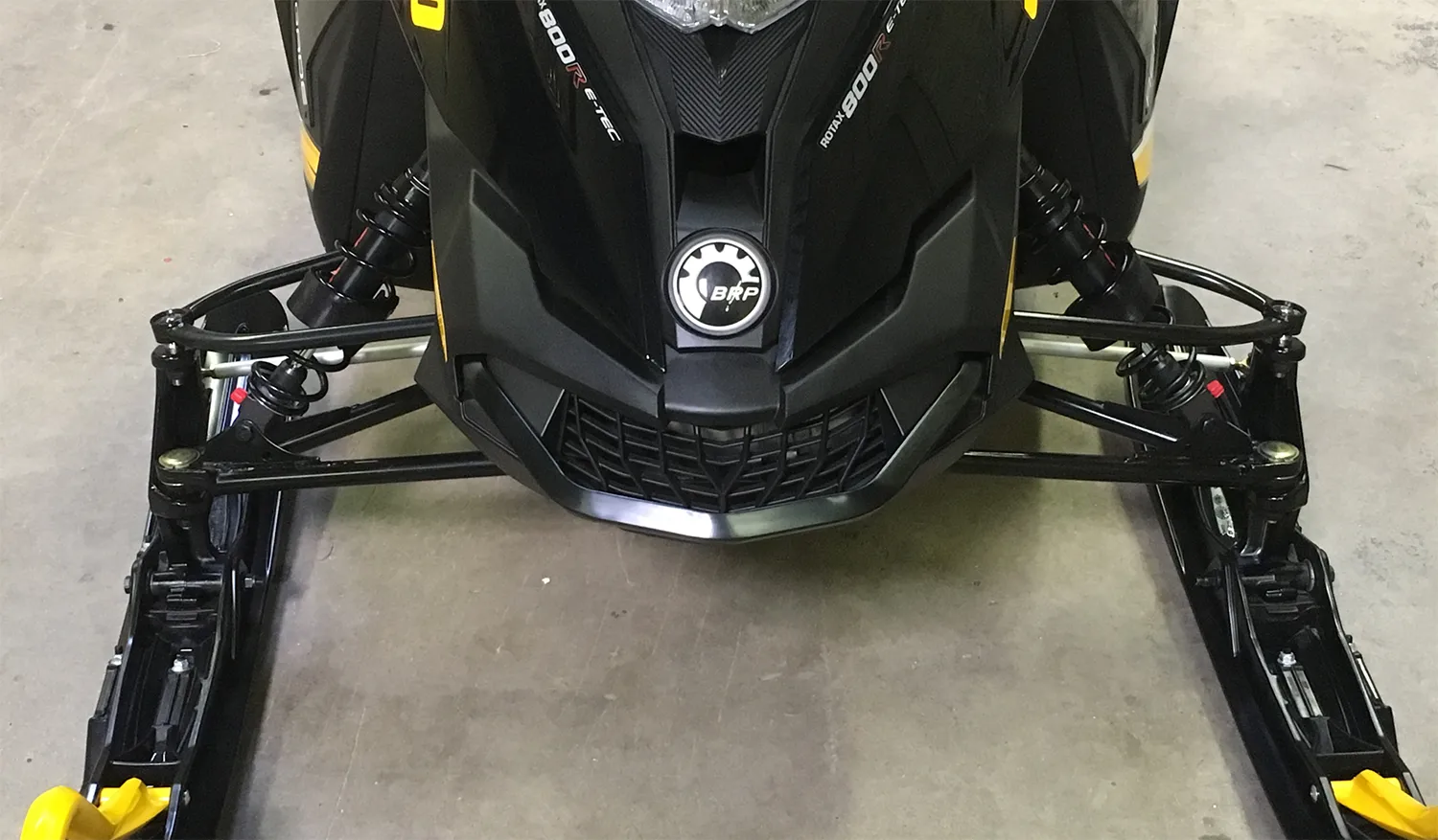 the front of a snowmobile with biteharder's polytune rings installed